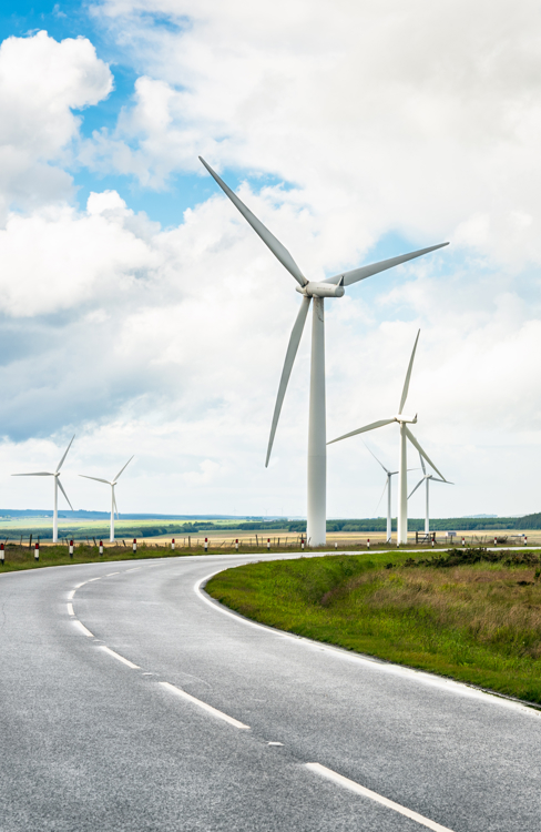 Country road through wind farm